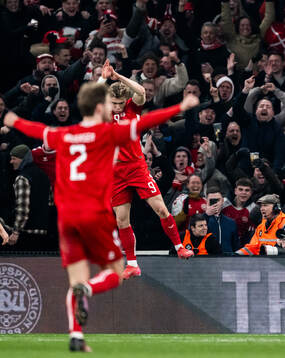 Rasmus Højlund of Denmark celebrates after scoring the 1-0 goal