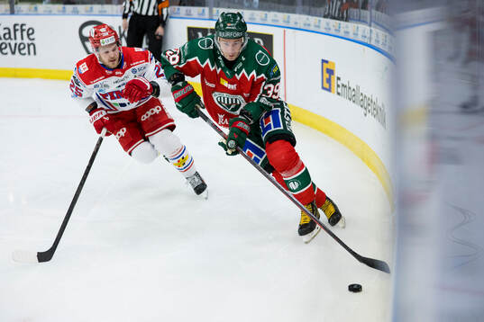 Timrås Linus Nässén och Frölundas Mikael Ruohomaa