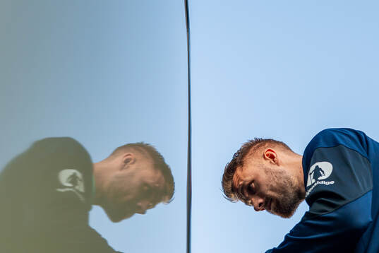 Kristoffer Ajer of the Norwegian national football team enters the team bus arriving at Chisinau International Airport