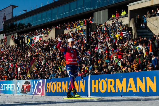 Lou Jeanmonnot of France celebrates at the finish of women's 10 km pursuit
