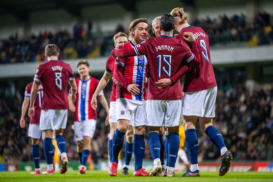 Aron Dønnum of Norway celebrates with Patrick Berg and teammates after scoring 0-5