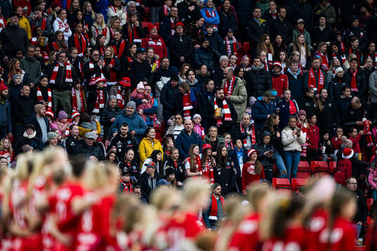 Spectators in the stands ahead of the Toppserien football match between Brann and Rosenborg on March 23, 2025 in Bergen.