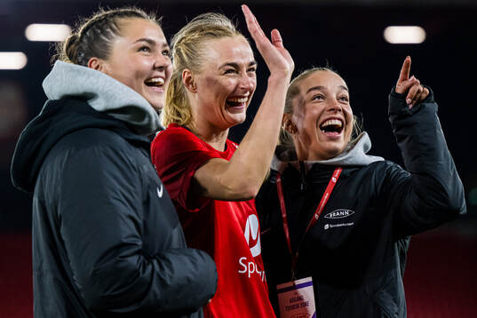 Anna Nerland Aahjem, Mia Authen and Rikke Nygard of Brann celebrates