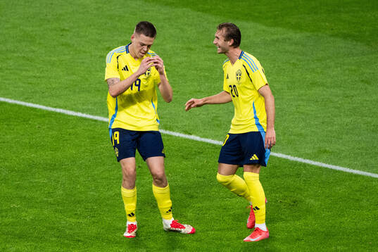 Emil Holm and Benjamin Nygren of Sweden celebrate after 1-0