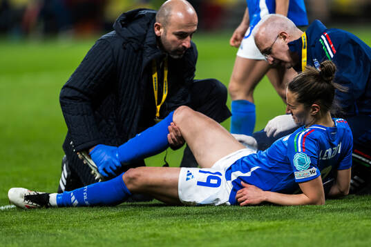 Martina Lenzini of Italy receives medical attention
