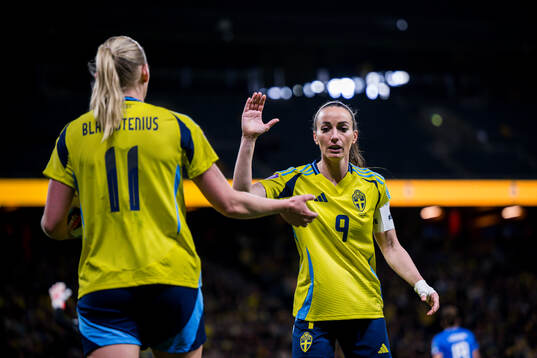 Stina Blackstenius and Kosovare Asllani of Sweden celebrate