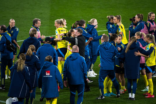 Magdalena Eriksson and Head coach Peter Gerhardsson of Sweden celebrate