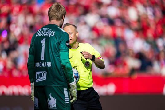 Jakob Let Haugaard of Tromsø and Ola Hobber Nilsen, referee