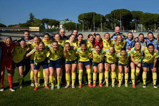 Players and staff of Sweden celebrate