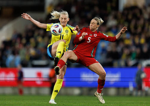 Stina Blackstenius of Sweden and Rhiannon Roberts of Wales