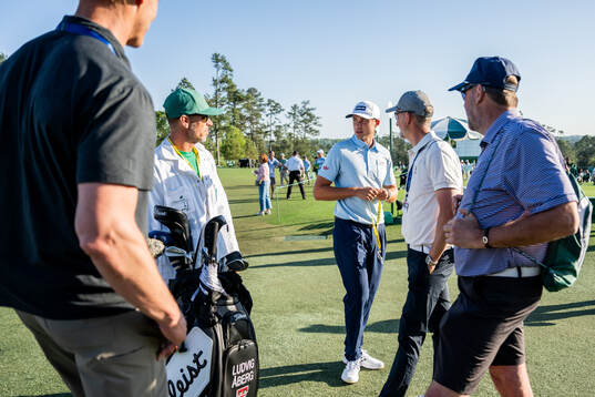 Ludvig Åberg of Sweden with caddie Joe Skovron, coach Hans Larsson and his father Johan Ungesson
