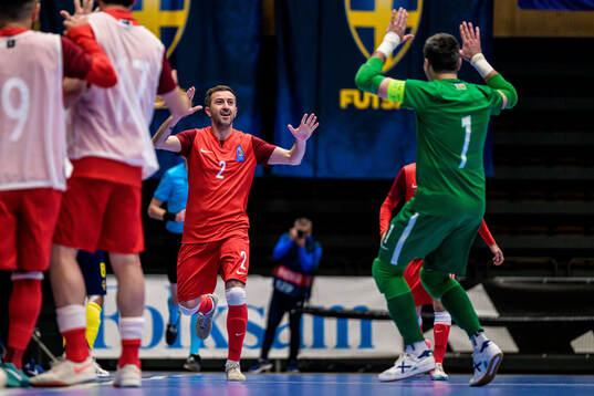 Rustam Baghirov of Azerbaijan celebrates after 1-3