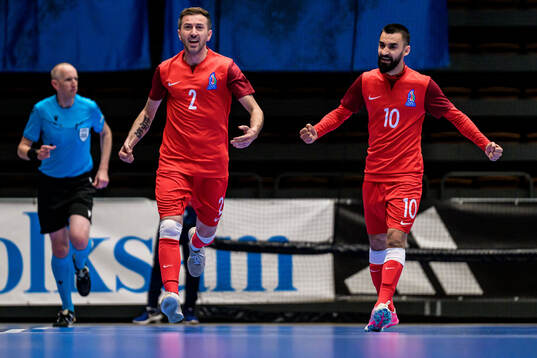 Rustam Baghirov and Murad Guluzade of Azerbaijan celebrates after 1-3