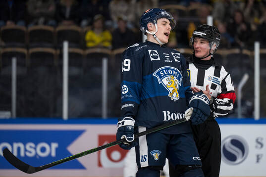 Waltteri Merelä of Finland in a discussion with a referee