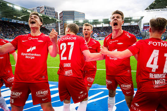 Eivind Helland, Mads Berg Sande, Aune Heggebø and Emil Kornvig of Brann celebrates after the 2-3 goal