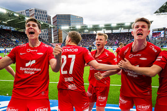 Eivind Helland, Mads Berg Sande, Aune Heggebø and Emil Kornvig of Brann celebrates after the 2-3 goal