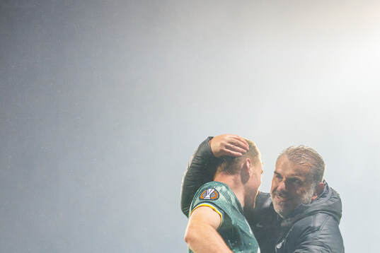 Dejan Kulusevski and head coach Ange Postecoglou of