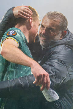 Dejan Kulusevski and head coach Ange Postecoglou of