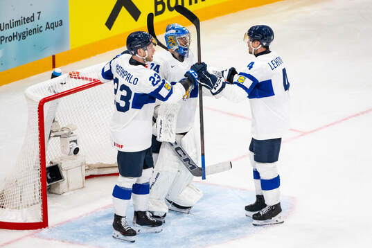 Nikolas Matinpalo, goaltender Juuse Saros and Mikko
