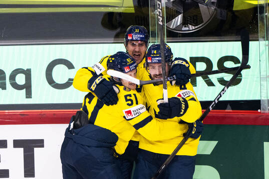 Mikael Backlund of Sweden celebrates with Emil Heineman and