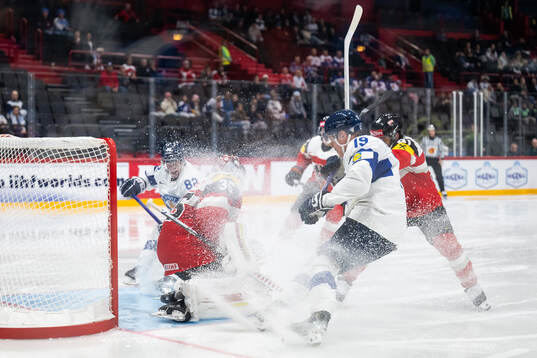 Goaltender Atte Tolvanen of Austria and Waltteri Merelä of