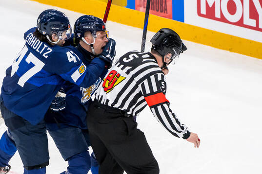 Eemil Erholtz and Harri Pesonen of Finland skate into