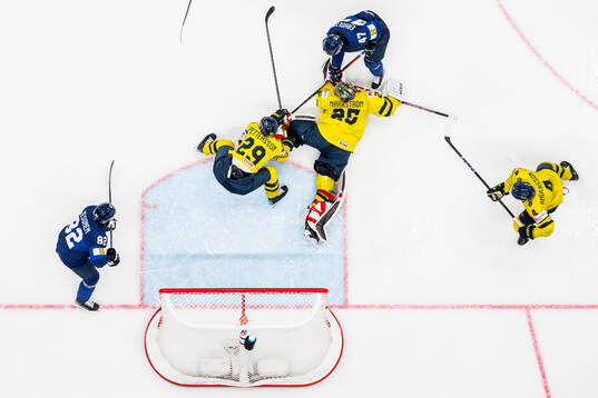 Marcus Pettersson and goaltender Jacob Markström of Sweden