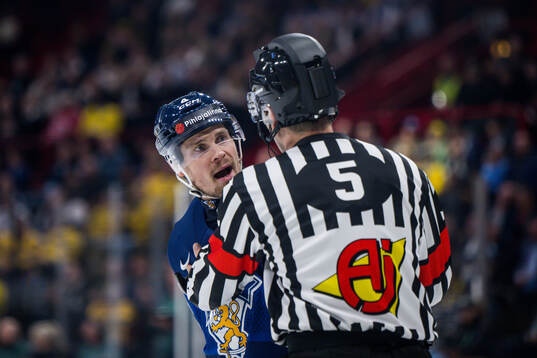 Mikko Lehtonen of Finland in a discussion with referee