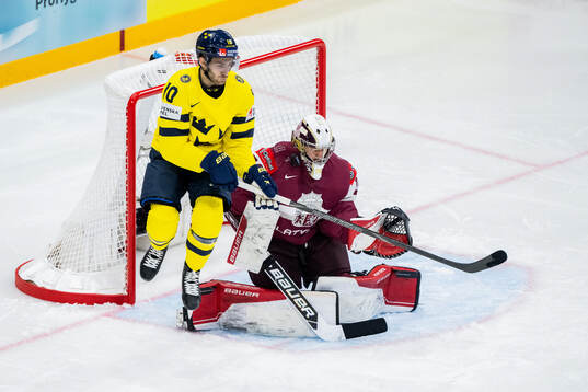 Alexander Wennberg of Sweden and goalkeeper Kristers