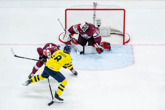 Jonas Brodin of Sweden against Kristaps Roberts Zile and