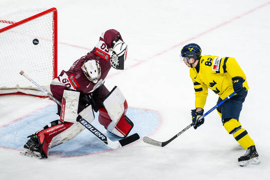 Jesper Frödén of Sweden against goalkeeper Kristers