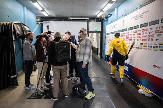 coach Sam Hallam of Sweden in the mixed zone after a practice session