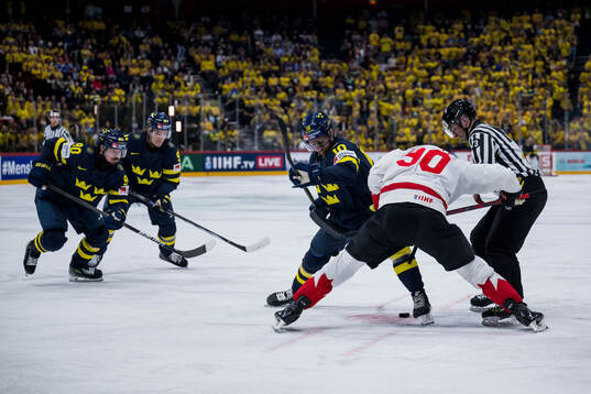 Marcus Johansson, Leo Carlsson and Alexander Wennberg of Sweden against Ryan O'Reilly of Canada 