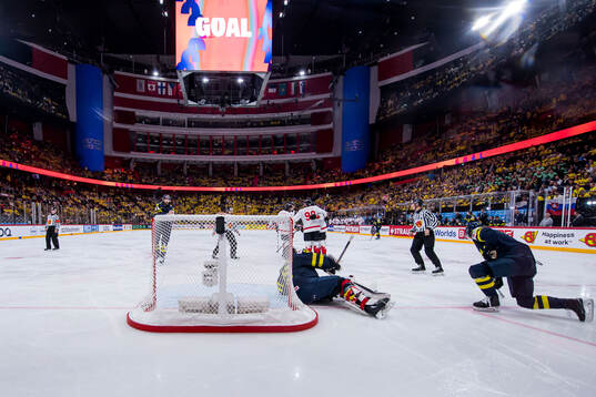 Goaltender Jacob Markström and Rasmus Andersson of Sweden look dejected 2-5 scored by Nathan MacKinnon of Canada