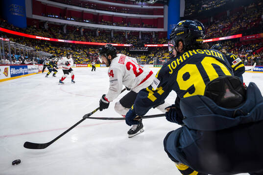 Phillip Danault of Canada and Marcus Johansson of Sweden