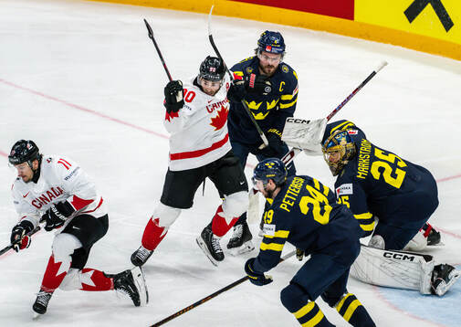 Brayden Schenn of Canada and Rasmus Andersson of Sweden