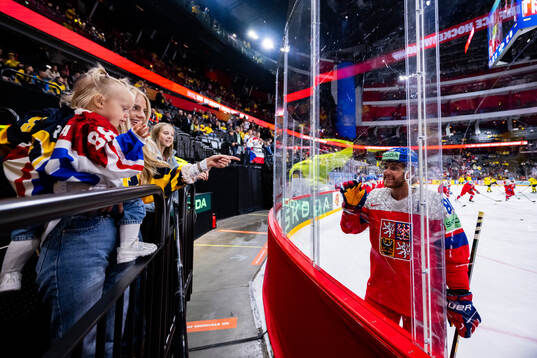 David Pastrnak of Czech Republic gestures to his girlfriend Rebecca Rohlsson and child Freya Ivy Pastrňák ahead of the 2025 IIHF Ice Hockey World Championship quarterfinal game between Sweden and Czech Republic on May 22, 2025 in Stockholm. 