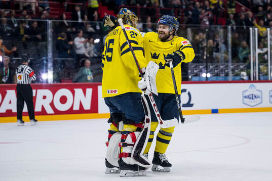 Jacob Markström and Rasmus Andersson of Sweden celebrate