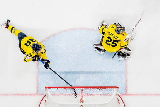 Rasmus Sandin with a save behind goalkeeper Jacob Markström of Sweden