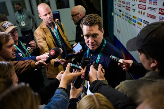Head coach Sam Hallam of Sweden is being interviewed by media at a practice session