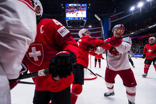 Janis Moser and Andrea Glauser of Switzerland against Mikkel Aagaard and Joachim Blichfeld of Denmark