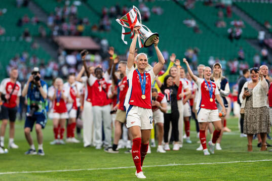 Stina Blackstenius of Arsenal celebrates with the trophy