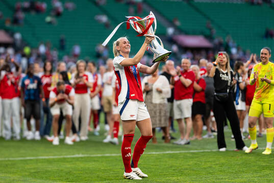 Stina Blackstenius of Arsenal celebrates with the trophy