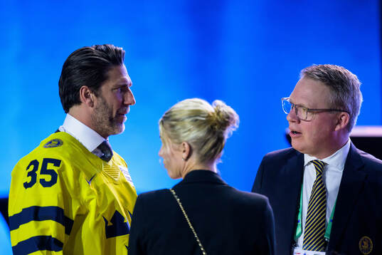 Henrik Lundqvist of Sweden, his wife Therese Andersson and Anders Larsson, IIHF Council member and president of the Swedish Ice Hockey Association, ahead of the IIHF Hall of Fame Ceremony on May 25, 2025 in Stockholm. 