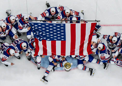 Players of USA celebrate with the winner’s trophy
