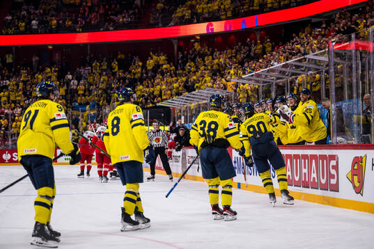 Marcus Johansson of Sweden celebrates with team mates after 3-0