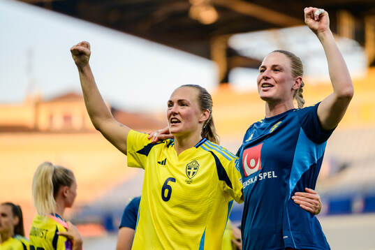Magdalena Eriksson and goalkeeper Tove Enblom of Sweden