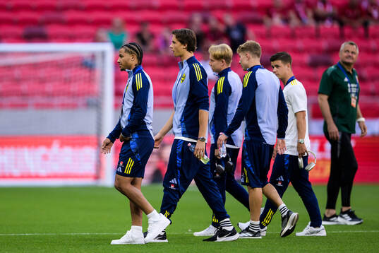 Momodou Sonko and John Mellberg of Sweden