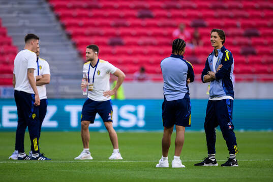 Momodou Sonko and John Mellberg of Sweden