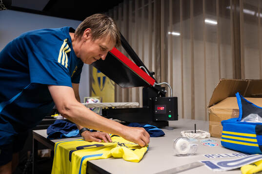 Equipment manager Jessica Karlsson prints Kosovare